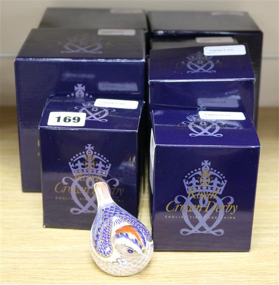 Seven boxed Royal Crown Derby paperweights,